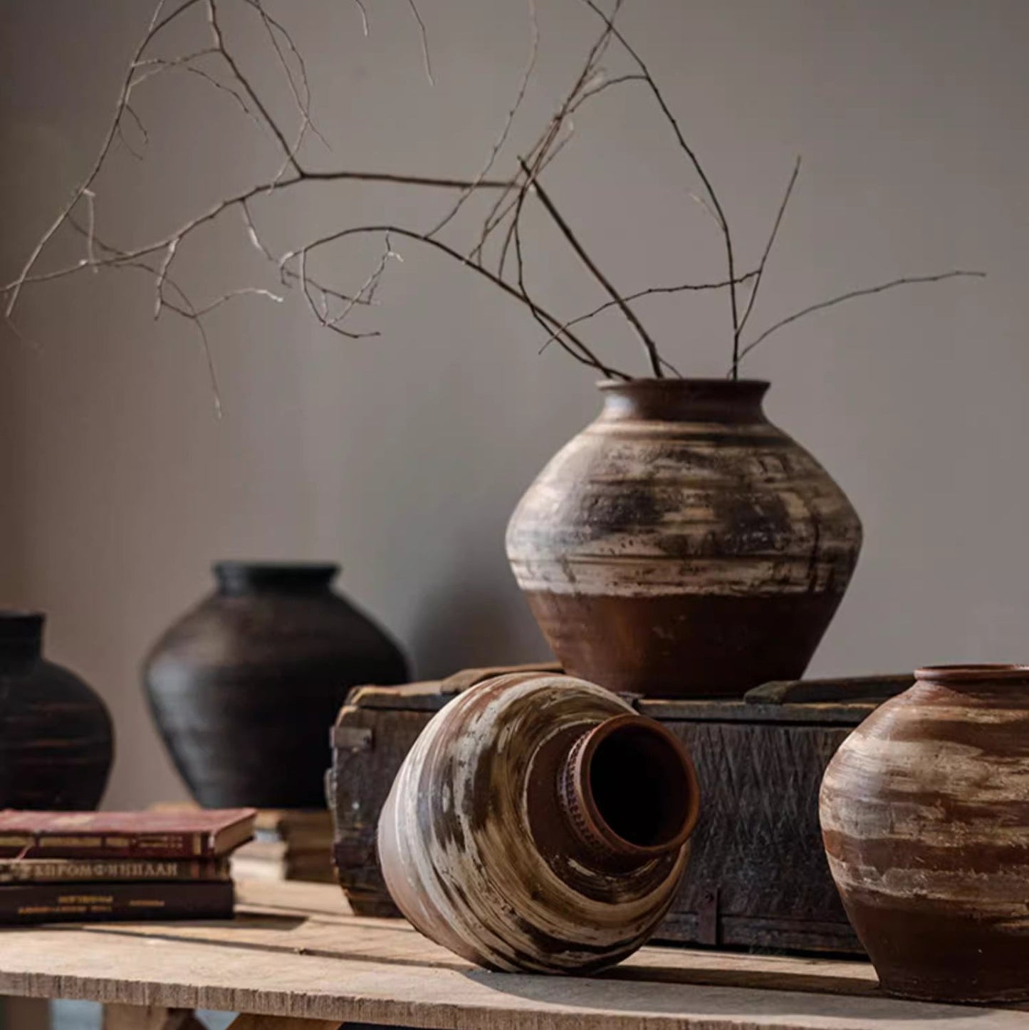 Large imperfect pottery as sculptural floor accent