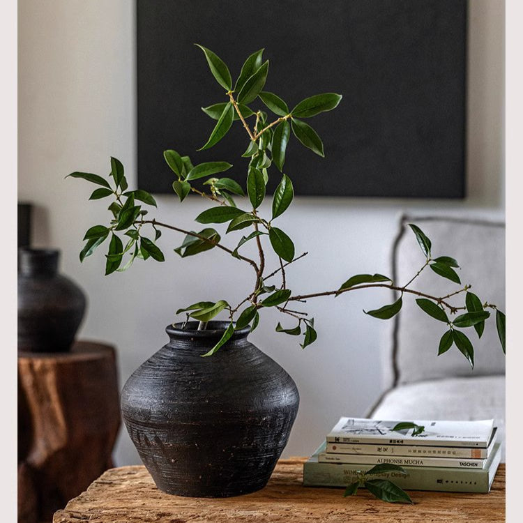 Dark gray wabi-sabi ceramic planter with organic textures