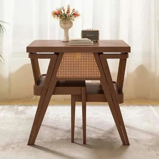 Wooden desk with a chair in a room with white curtains