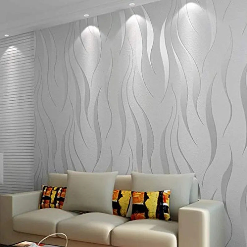 A wavy 3D embossed wallpaper with silver and purple hues in a living room setting, featuring a textured metallic wall covering.