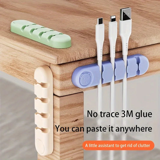 Cable management system with 3M glue on a wooden surface