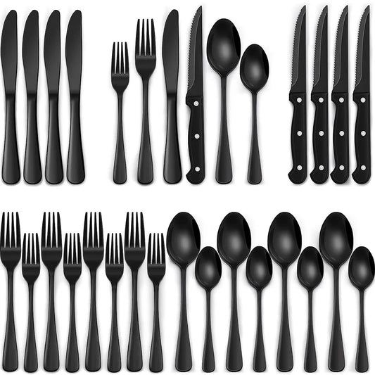 Set of black cutlery including knives, forks, and spoons on a white background