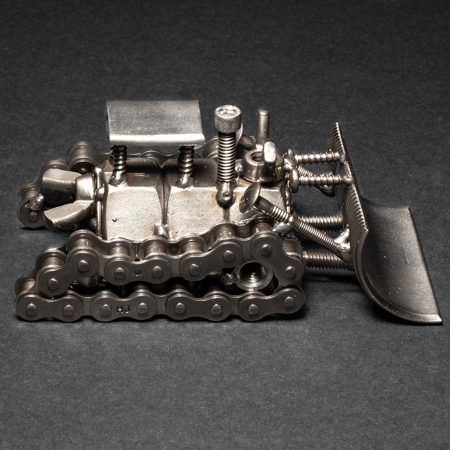 Welded nuts and bolts dozer sculpture for construction lovers
