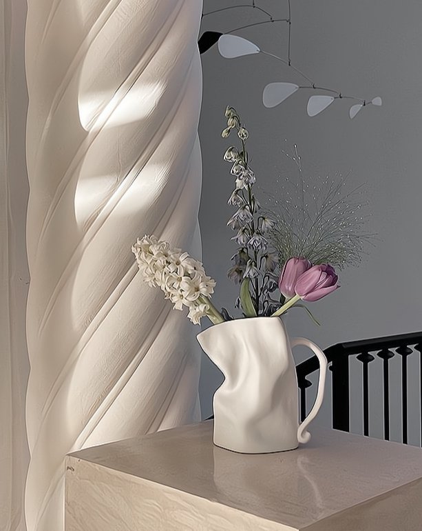 Handcrafted pottery vase with textured surface in black and white