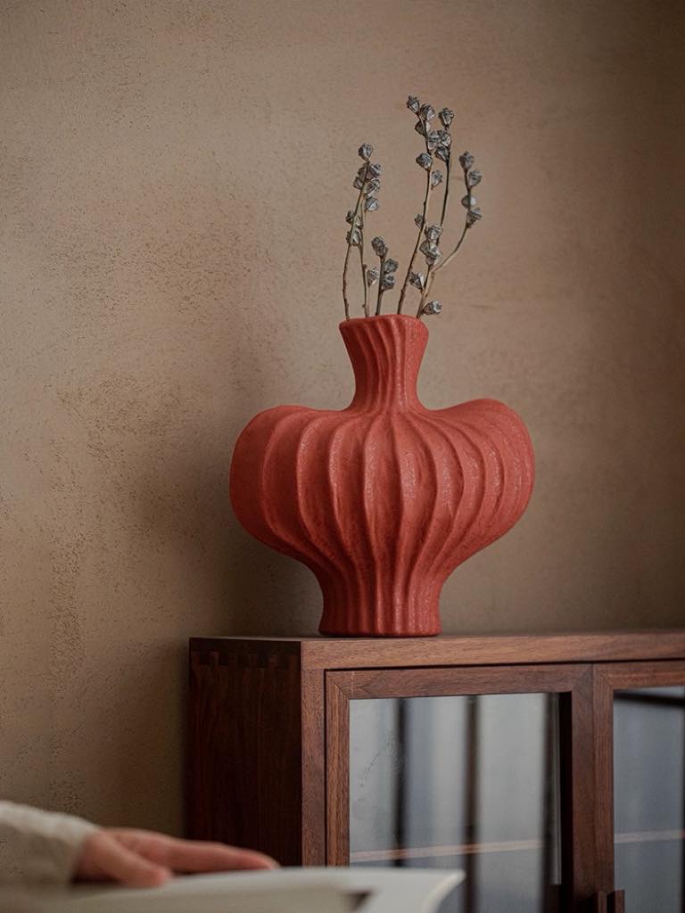 Japanese-inspired imperfect ceramic vase applying red theory