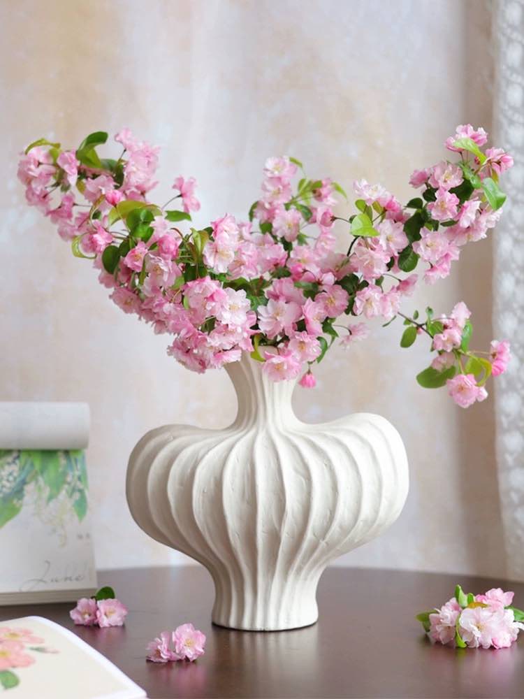 Handmade wabi-sabi vase in brick red for unexpected pop of color