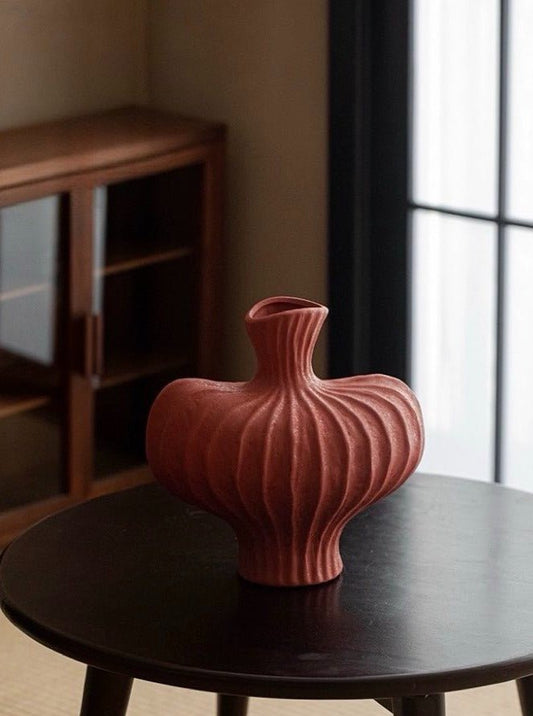 Handmade wabi-sabi vase in brick red for unexpected pop of color