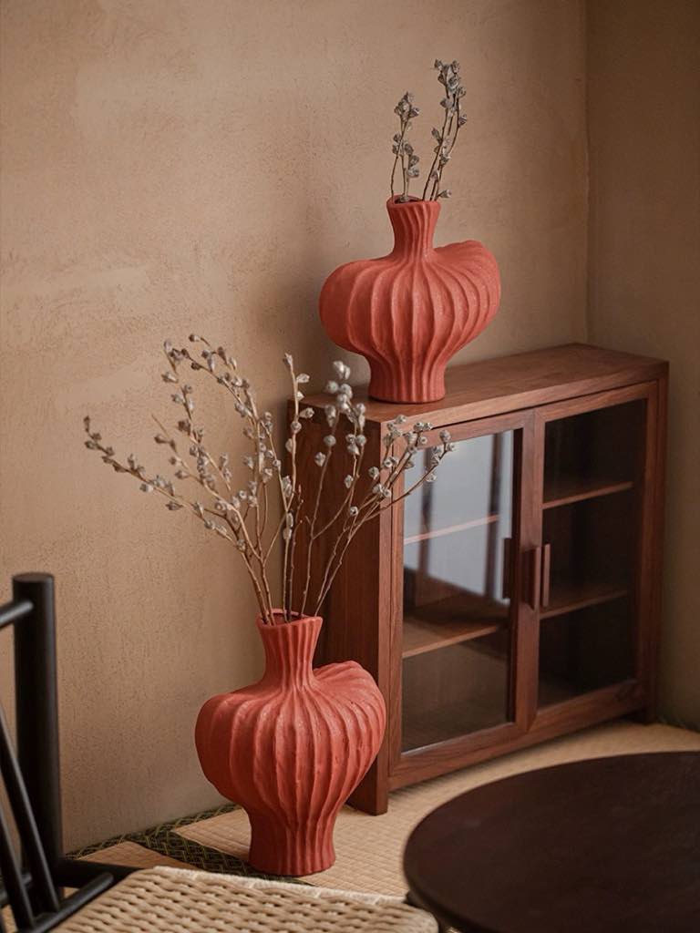Japanese-inspired imperfect ceramic vase applying red theory
