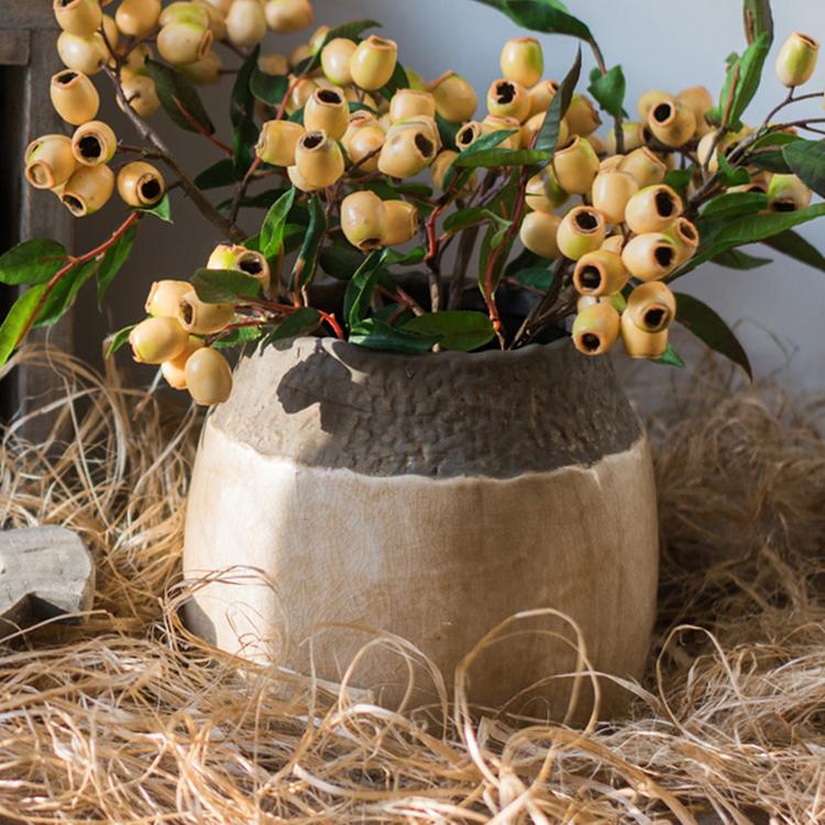 Handmade khaki coarse pottery jar with earthy tones
