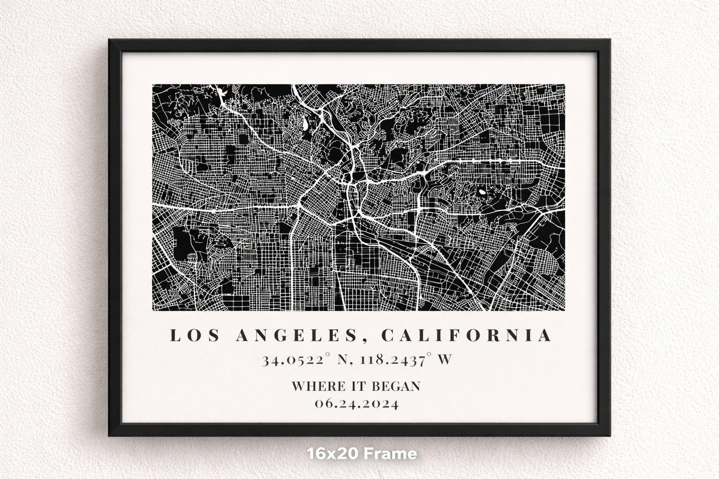 Framed black and white map of Los Angeles, California on a white wall.