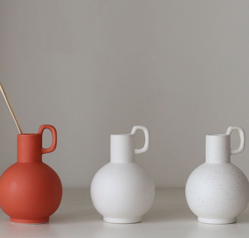 Artisan-crafted ceramic vase with textured surface for stylish interiors