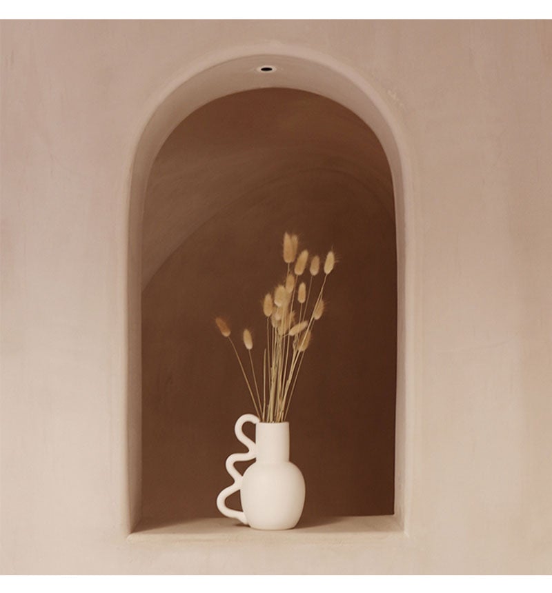 Artisan-crafted ceramic vase with textured surface for stylish interiors