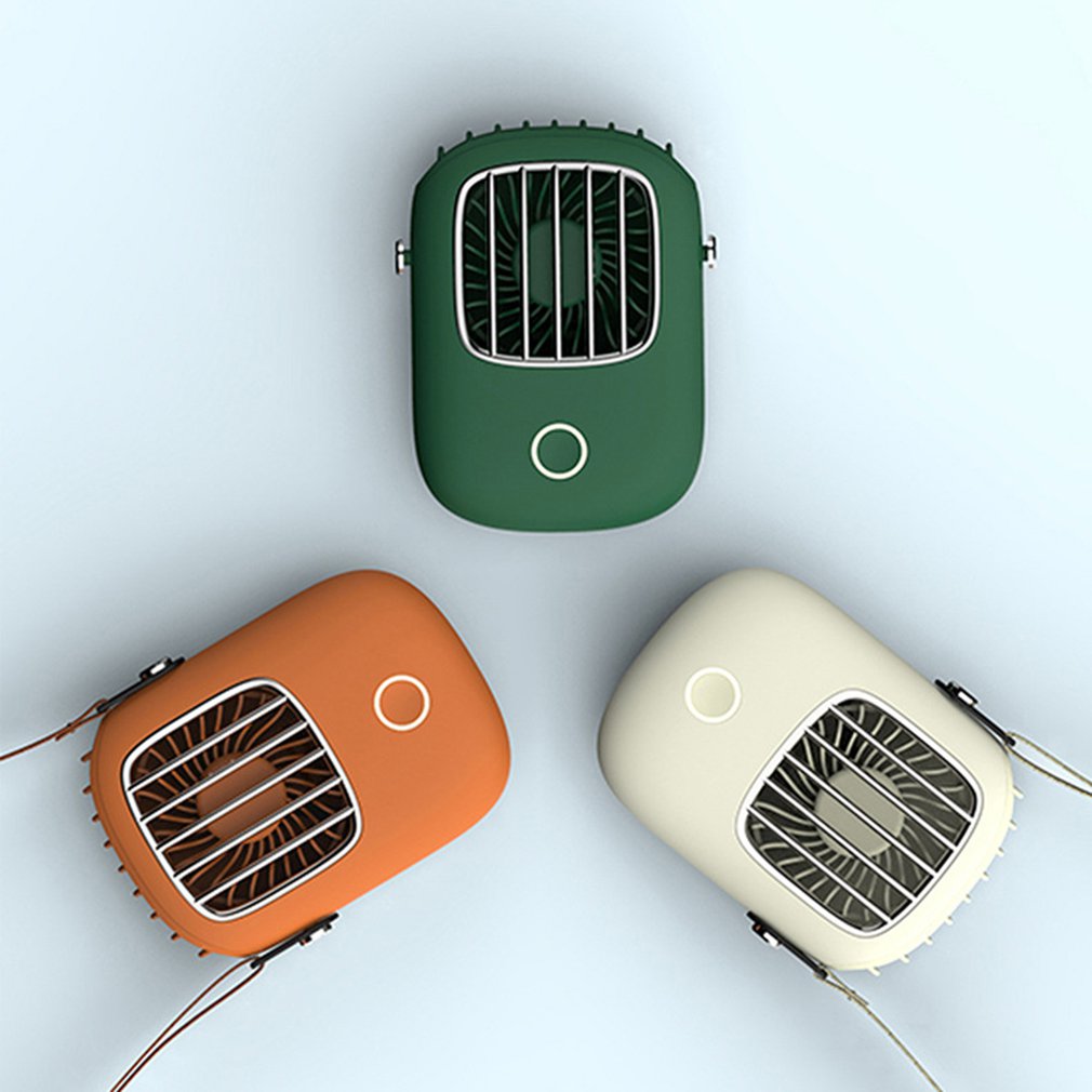 Three portable fans in green, orange, and beige on a light gray background