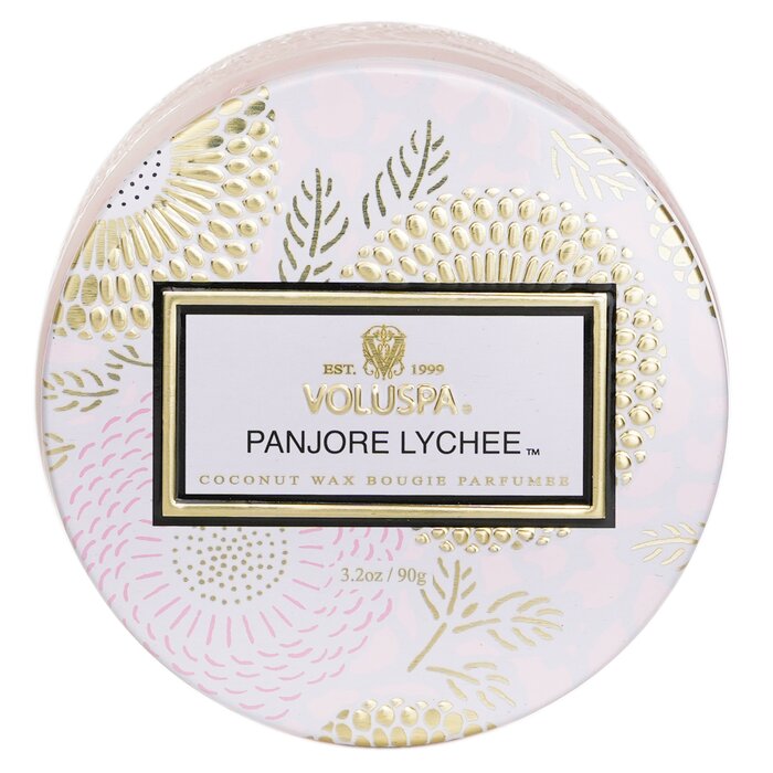 Round Voluspa Panjore Lychee candle packaging with decorative gold and pink design on a white background