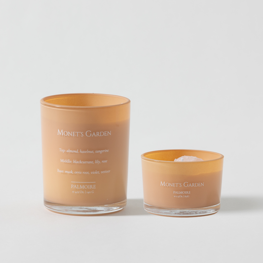 Two candles from 'Monet's Garden' on a light gray background