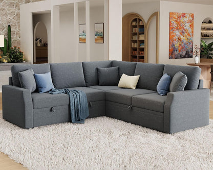Gray sectional sofa in a living room with decorative pillows and a rug.