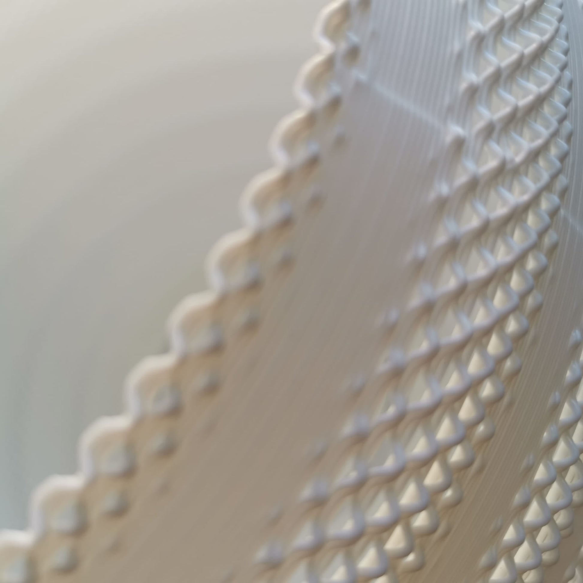 Close-up of a textured white fabric with a blurred background