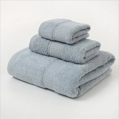 Stack of folded light blue towels on a white background