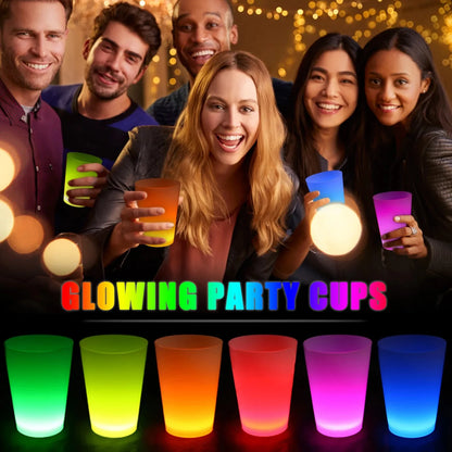 People holding glowing party cups with colorful lights against a dark background