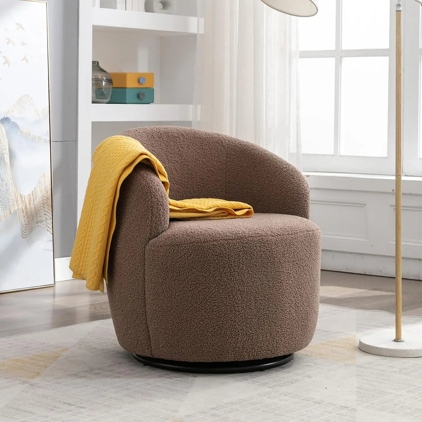 Brown armchair with a yellow blanket in a modern living room.