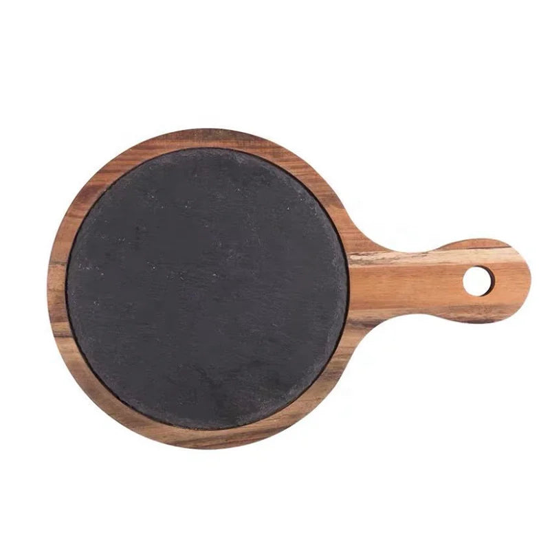 A round wooden serving board with a dark gray slate insert and a handle featuring a hanging hole, shown on a plain white background.