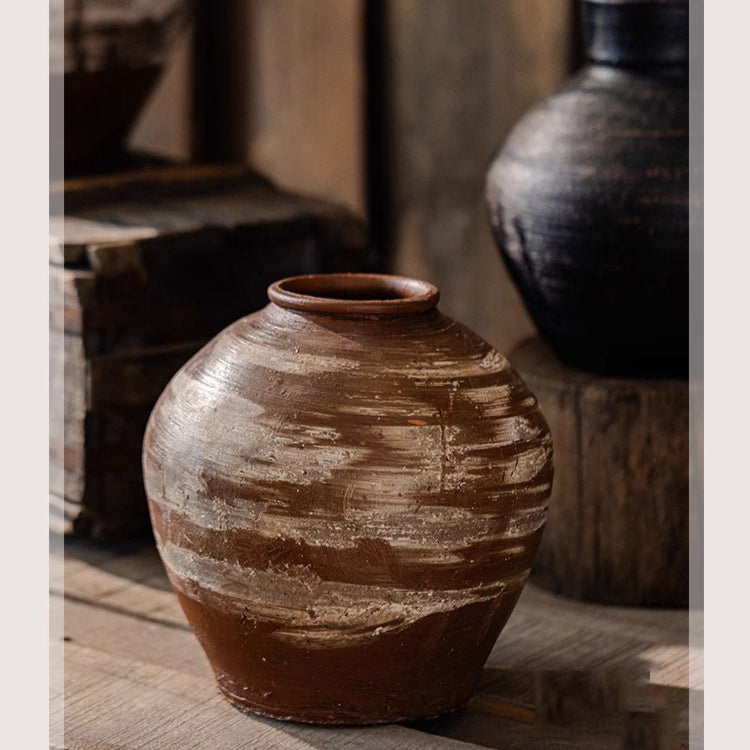 Large imperfect pottery as sculptural floor accent