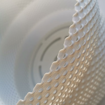 Close-up of a textured white object with a detailed pattern