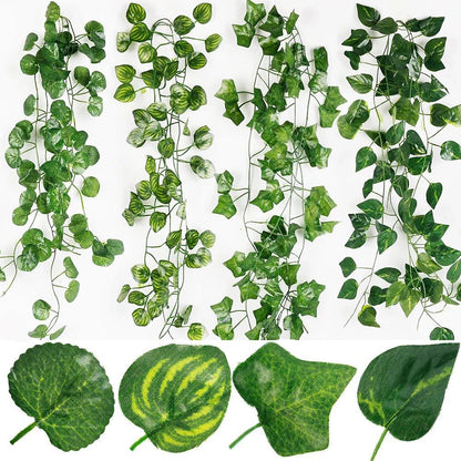 Collection of artificial green vines and leaves on a white background