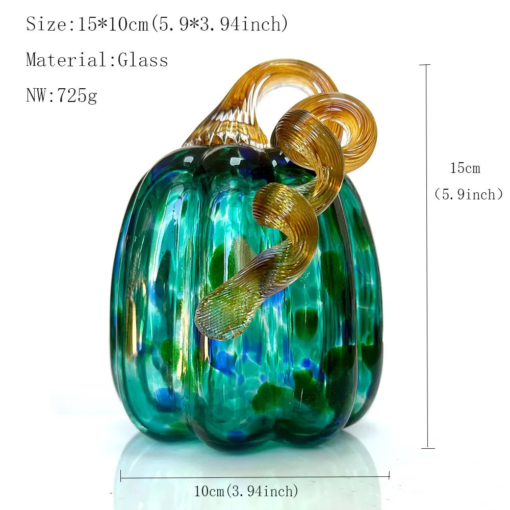Glass pumpkin with gold leaf design and measurements on a white background