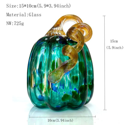 Glass pumpkin with gold leaf design and measurements on a white background