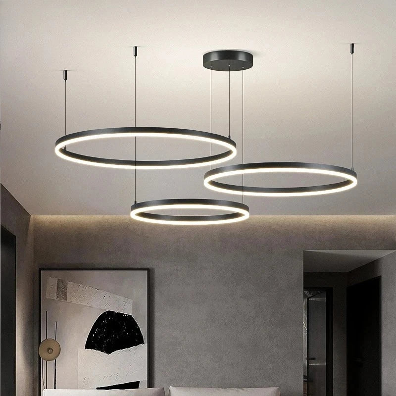 Modern pendant lights hanging in a room with a neutral color palette.