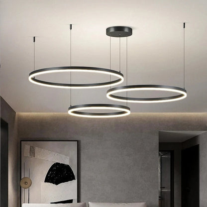 Modern pendant lights hanging in a room with a neutral color palette.