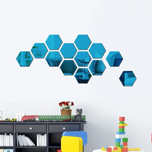 Hexagonal blue wall decors on a white wall with toys and books below.
