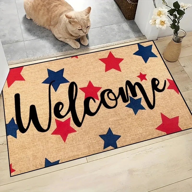 Doormat with 'Welcome' text and red and blue stars on a wooden floor, with a cat sitting on a step in the background.