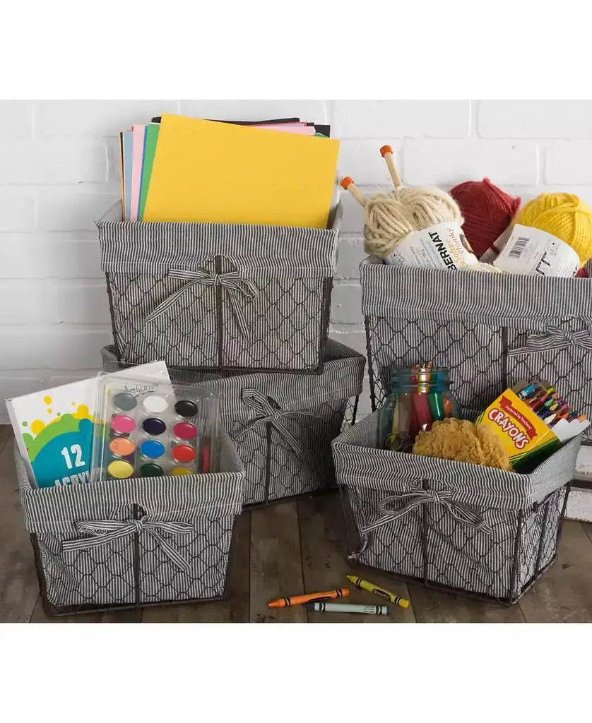 Lined wire storage baskets holding craft paper, yarn, paints, crayons, and art supplies.