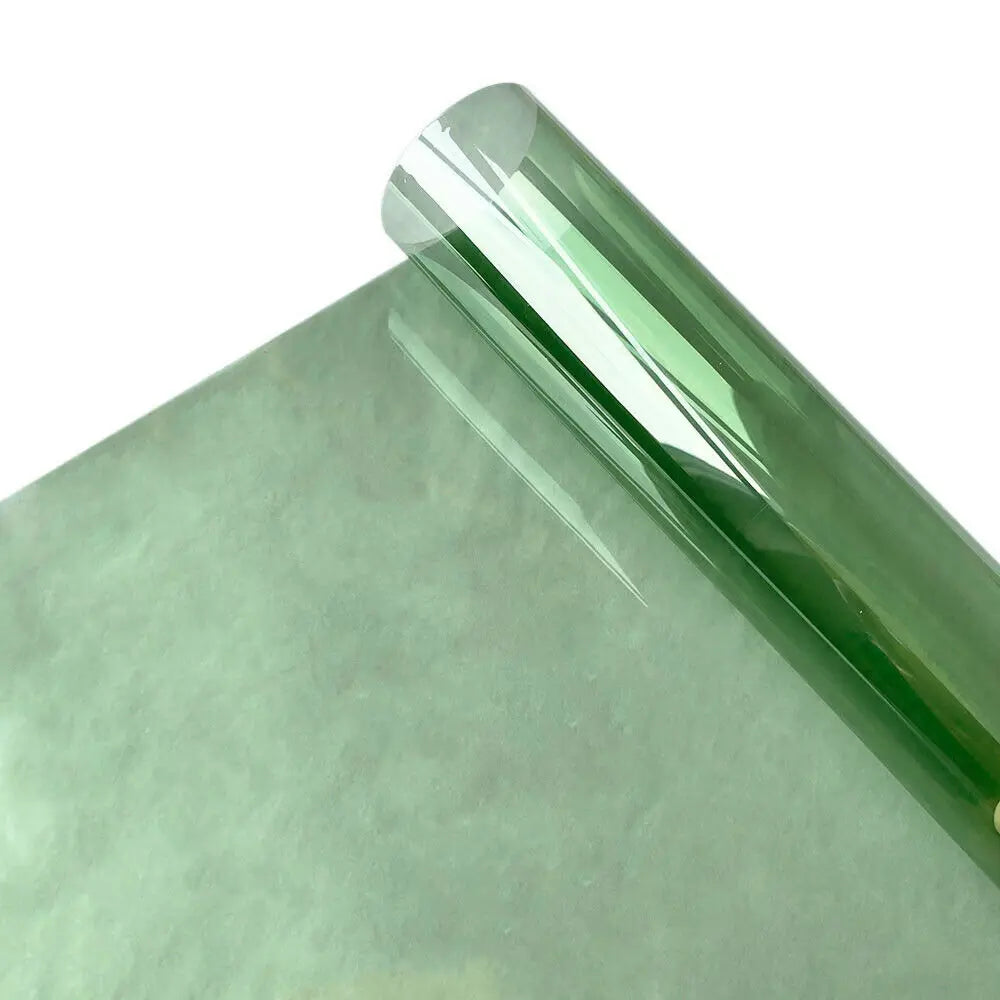 Green tinted film roll on a white background