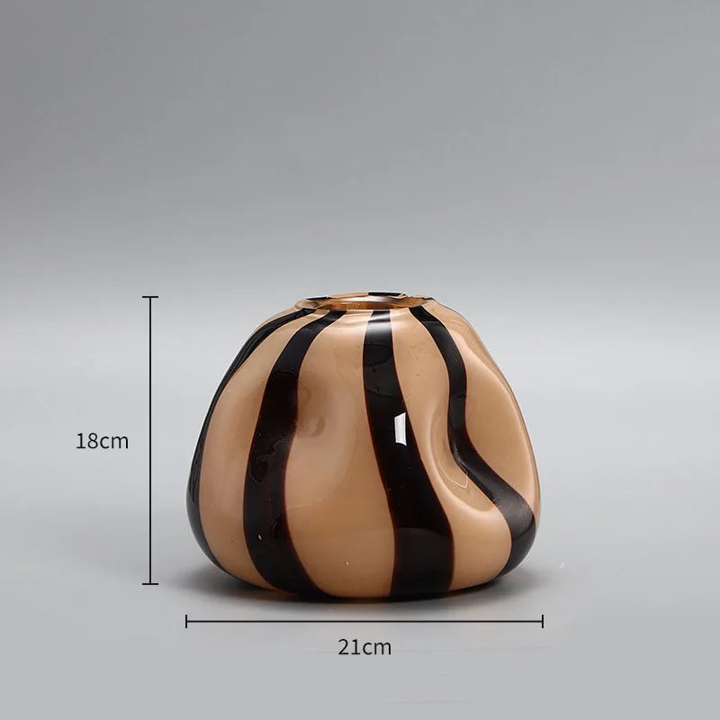 Ceramic vase with black and beige stripes and measurements on a gray background
