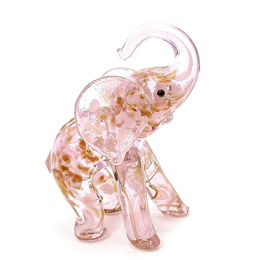 Pink glass elephant figurine on a white background