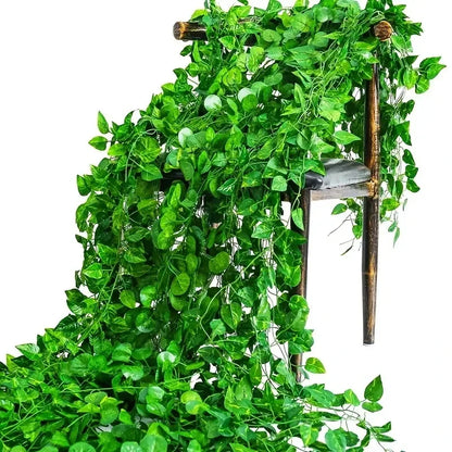 Artificial greenery with a wooden frame on a white background