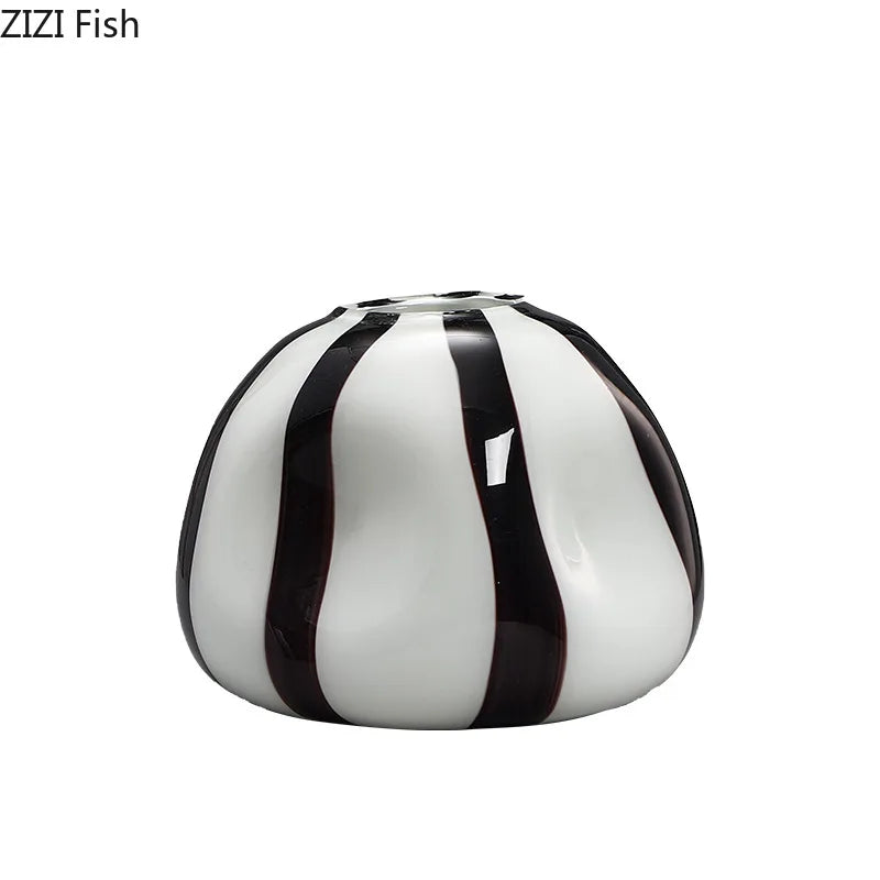 A glossy ceramic fish-shaped vase with vertical black stripes on a white base, shown on a plain white background. The text 'ZIZI Fish' is visible in the top-left corner.