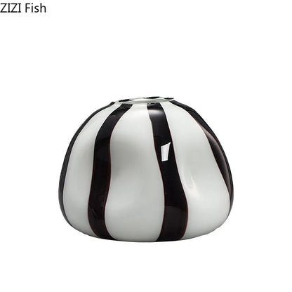 A glossy ceramic fish-shaped vase with vertical black stripes on a white base, shown on a plain white background. The text 'ZIZI Fish' is visible in the top-left corner.