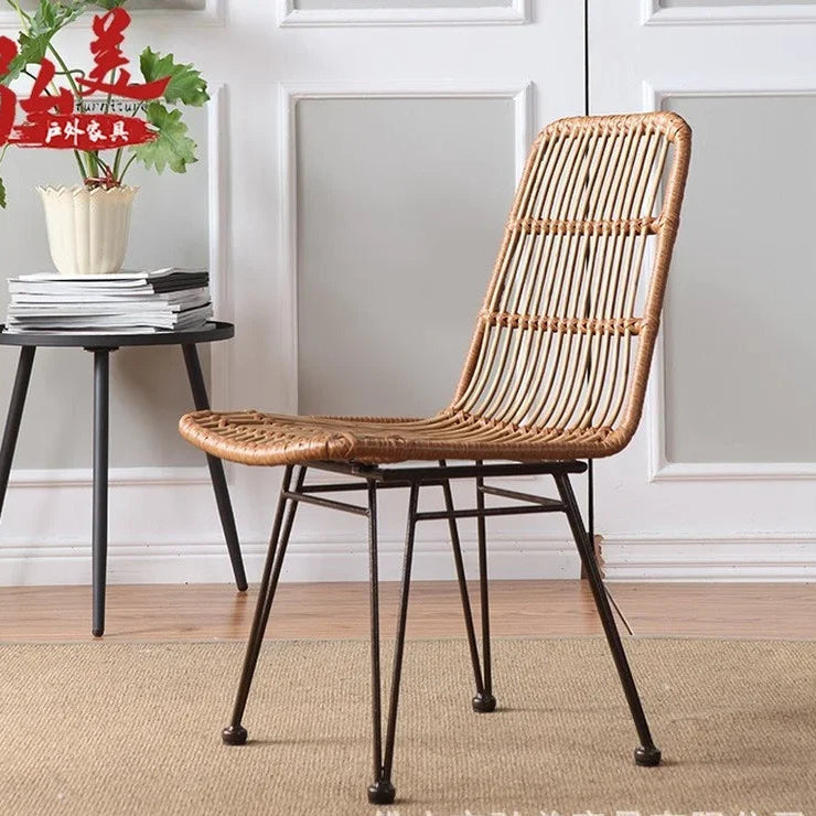 Woven chair with metal legs in a room setting