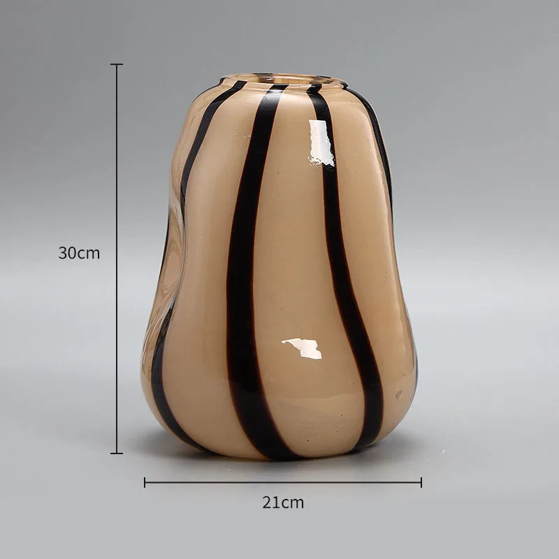 Beige vase with black stripes and measurements on a gray background