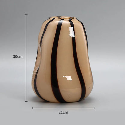 Beige vase with black stripes and measurements on a gray background