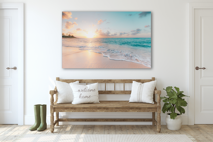 A piece of glass art depicting a tranquil ocean scene with waves and a soft sunset or sunrise color palette, displayed above a wooden bench with cushions, in a bright interior setting.