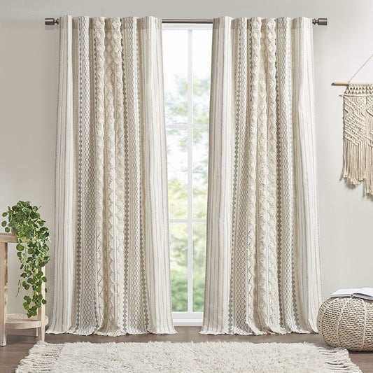 Imani artisanal cotton window panel with geometric print and tufted chenille stripes hanging in a well-lit living room.