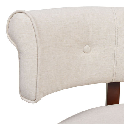 Close-up of a beige upholstered chair with button tufting on a white background