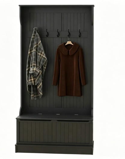 Black coat rack with hooks and storage bins, featuring a plaid coat and a brown coat.