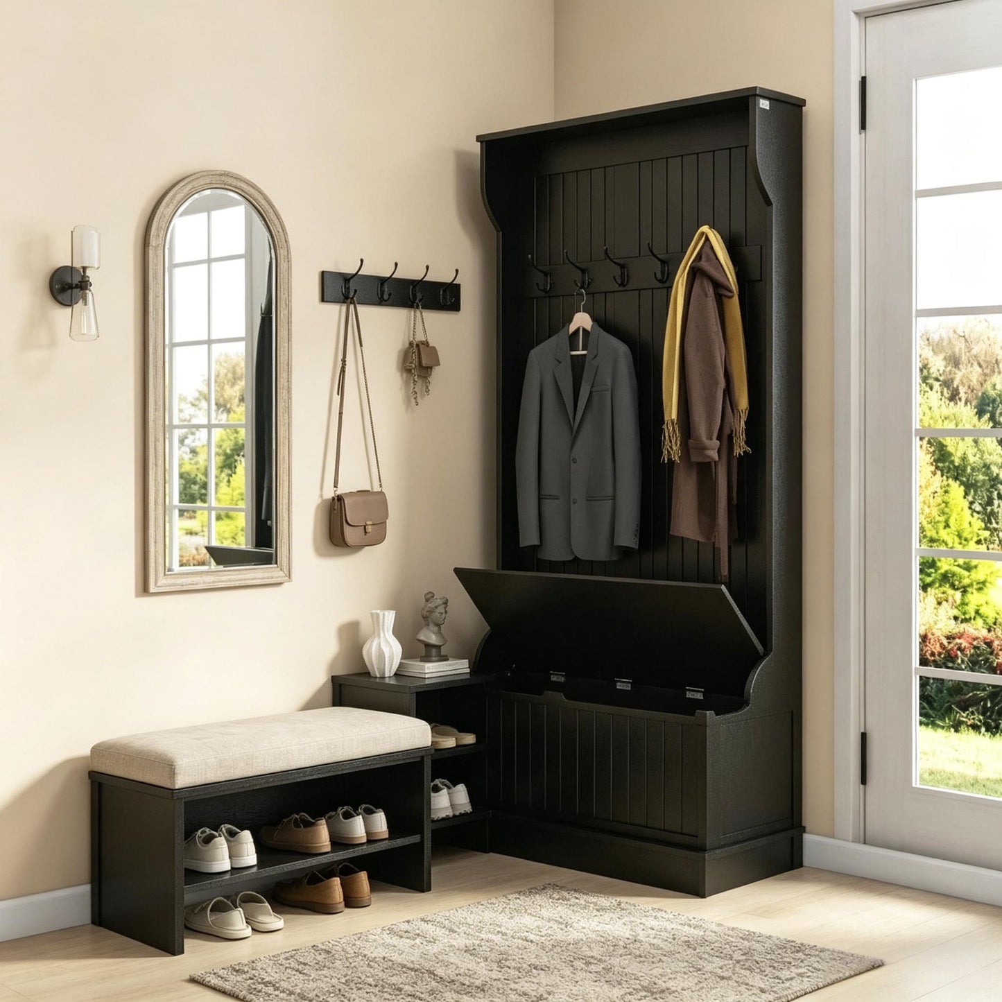 Entryway with black coat rack, mirror, and shoe storage bench.