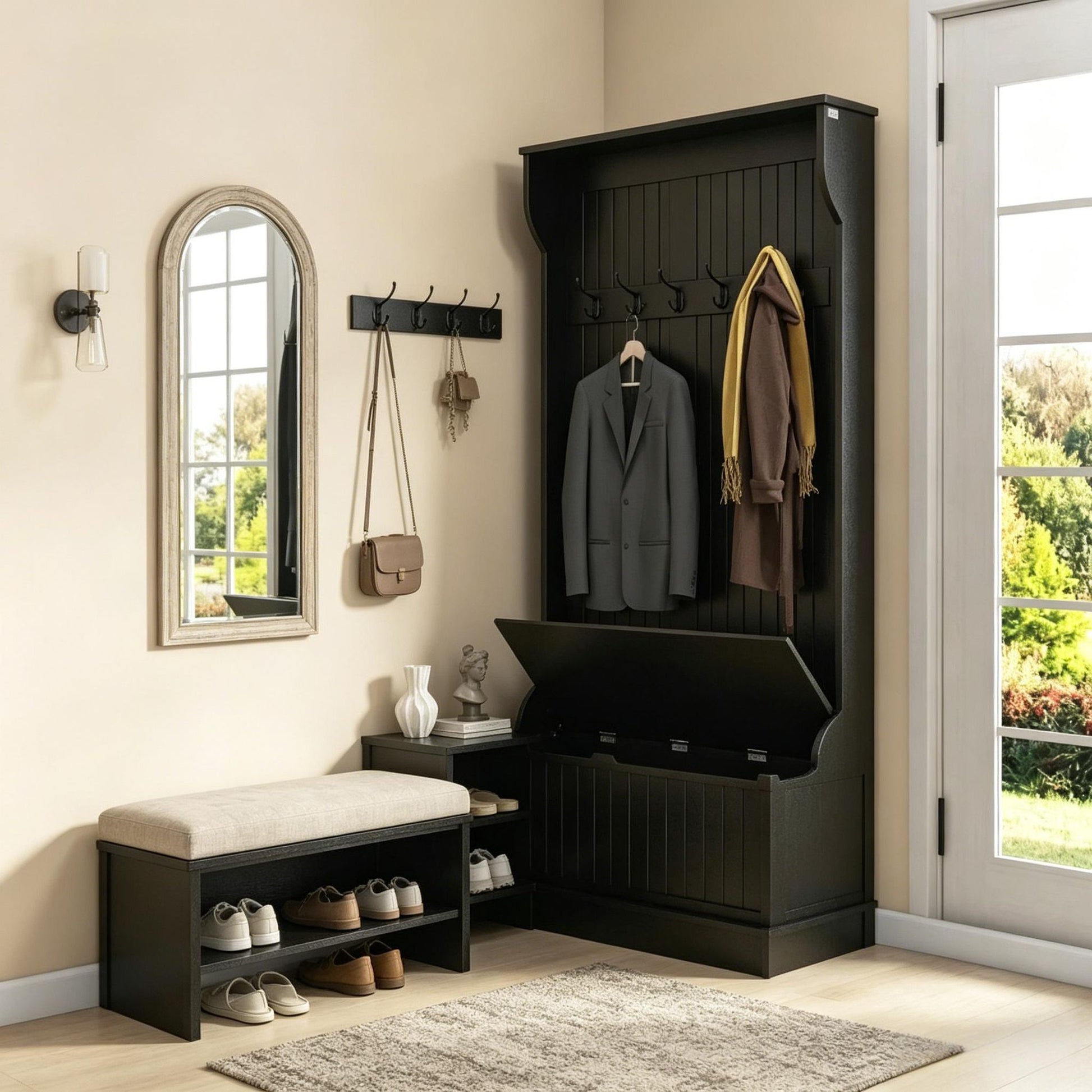 Entryway with black coat rack, mirror, and shoe storage bench.